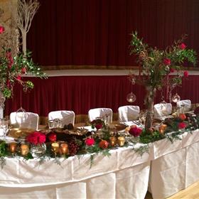 fwthumbTop table of manzanita trees, bark, pomegranites and roses.jpg